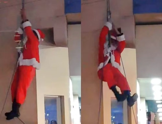 Papai Noel faz entrada inusitada de rapel e fica pendurado nas cordas 